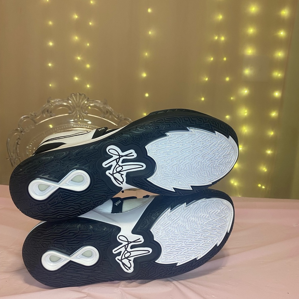 Nike Kyrie Infinity TB, in a white and black "Panda" colorway.